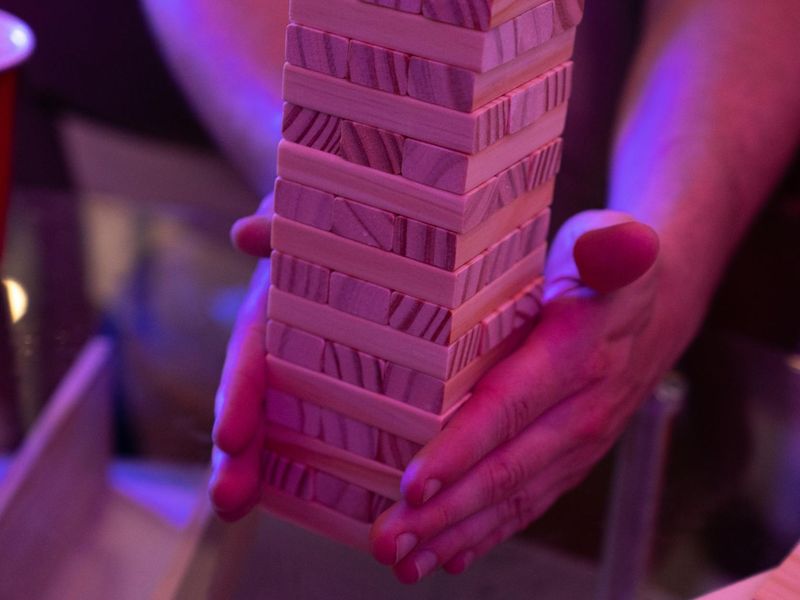 Close up of hands performing a steady yoga balance.